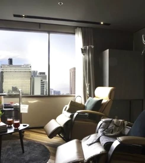 A recovery lounge at the clinic, with reclining chairs by the window.